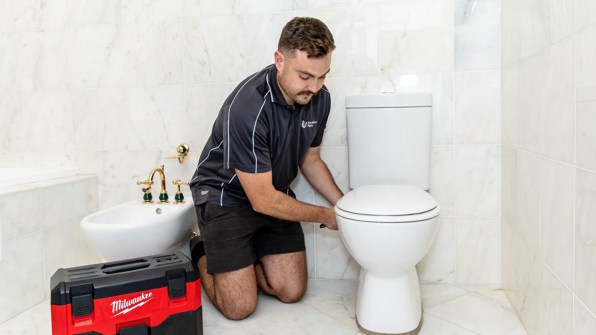 The base of a toilet pan where it meets the floor, the first place to look when a blockage backs up